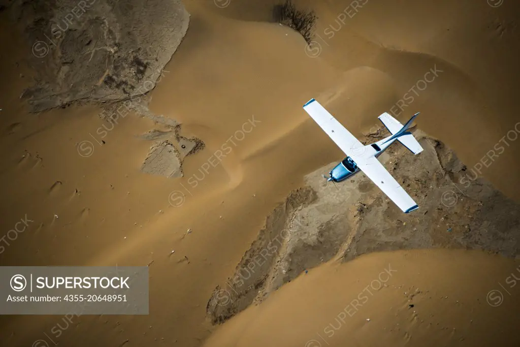 Airplane flying over desert of Namibia