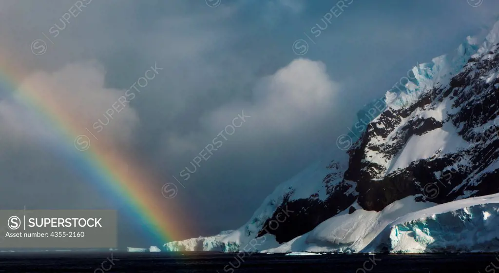 Rainbow over Neko Harbor. Neko Harbor located in Andvord Bay at the southern end of the scenic Errera Channel in Antarctica surrounded by active glaciers.