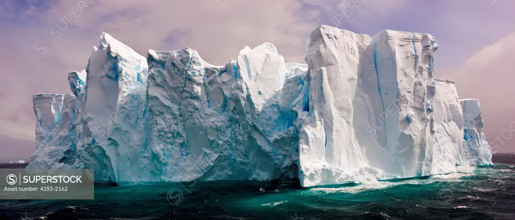 Massive Tabular Iceberg in  Neko Harbor. Neko Harbor located in Andvord Bay at the southern end of the scenic Errera Channel in Antarctica and surrounded by active glaciers.