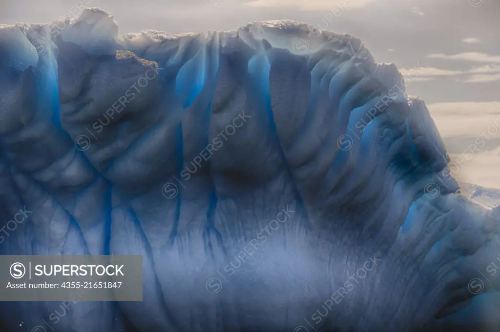 A blue striated iceberg off of Cuverville Island, Antarctica