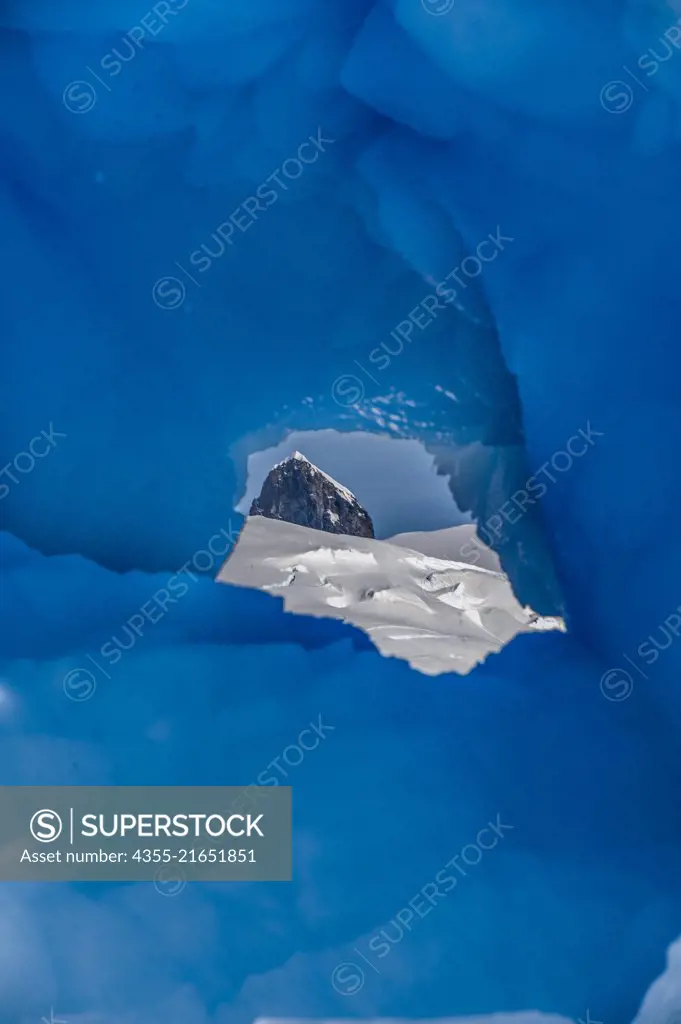 A view through an iceberg off of Cuverville Island, Antarctica