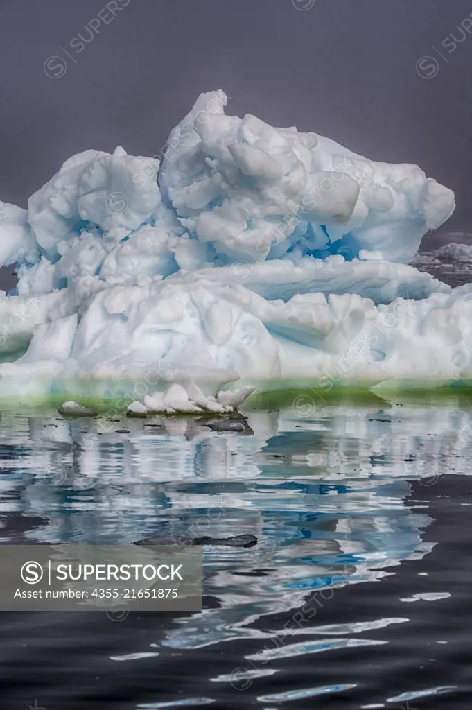 Reflections in the water around Blackhead, Antarctica