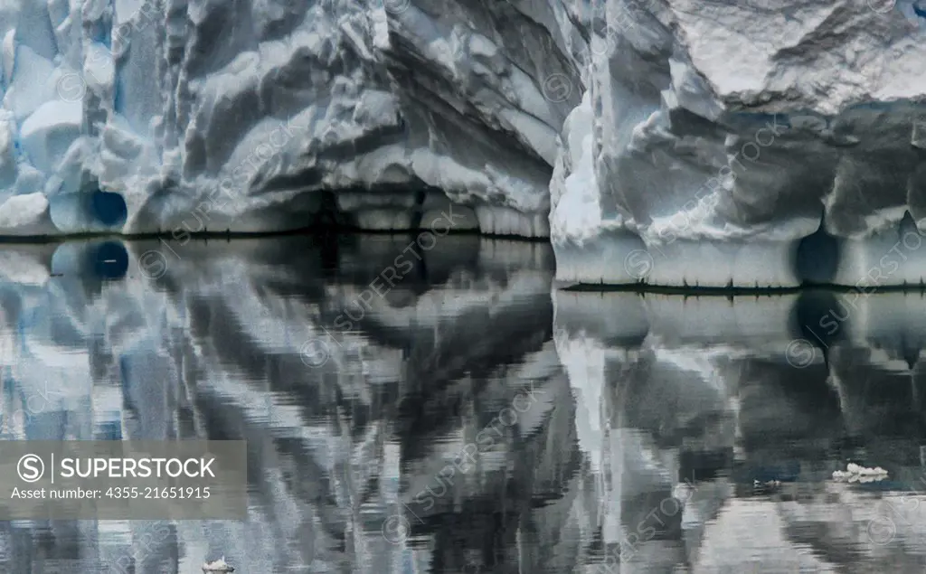 Reflections of icebergs in Harrison Passage, Antarctica