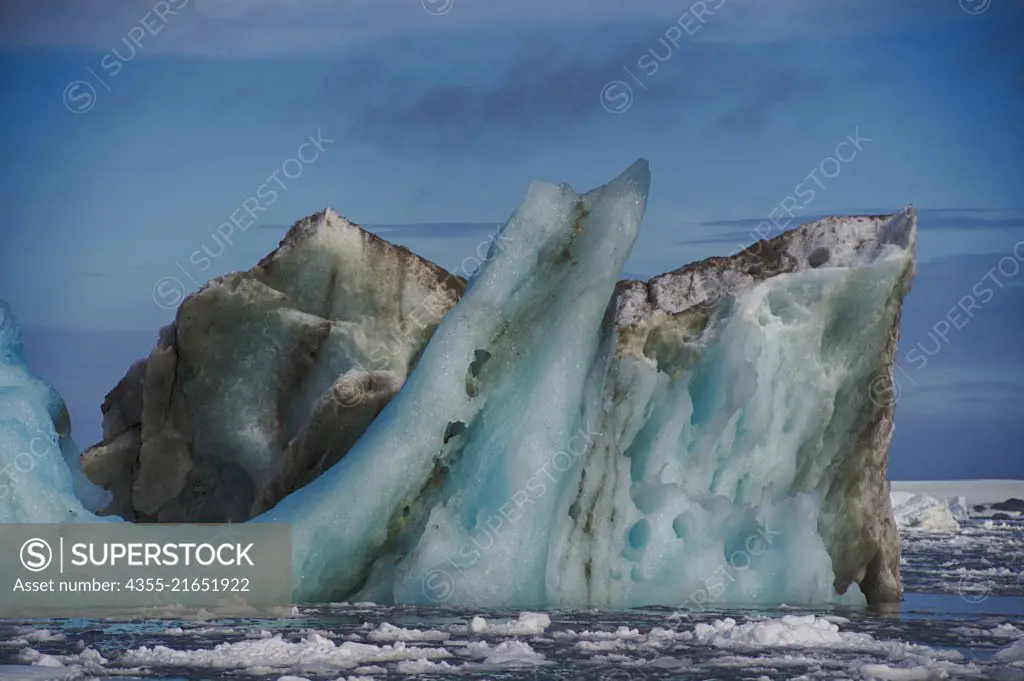 A very ancient iceberg falling apart in Cape Tuxen, Antarctica