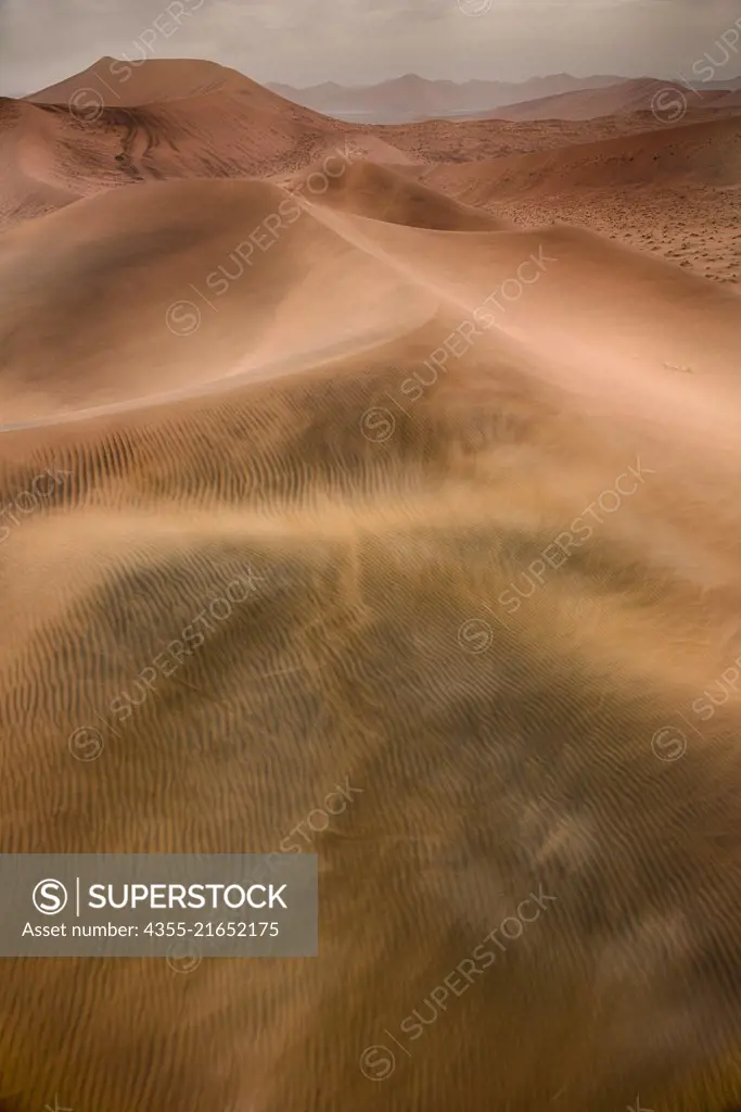 Sossusvlei is a salt and clay pan surrounded by high red dunes, located in the southern part of the Namib Desert, of Namibia