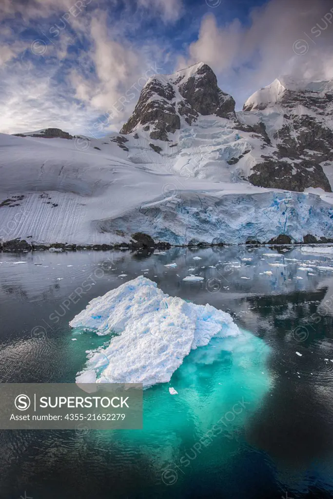 Reflections fill the Lemaire Channel which is one of the top tourist destinations in Antarctica with steep cliffs and an iceberg-filled passage and only 1600 meters wide at its narrowest point.