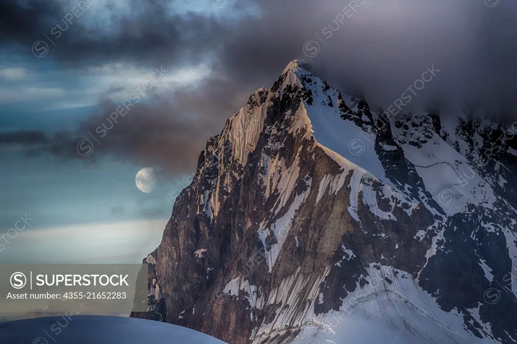 The moon rises off the peaks in the Lemaire Channel, Antarctica