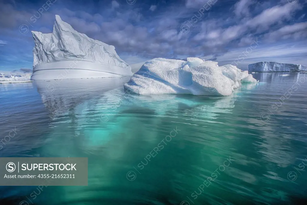 A spectacular view of an iceberg extending deep beneath the surface near Vernadsky Station in Antarctica