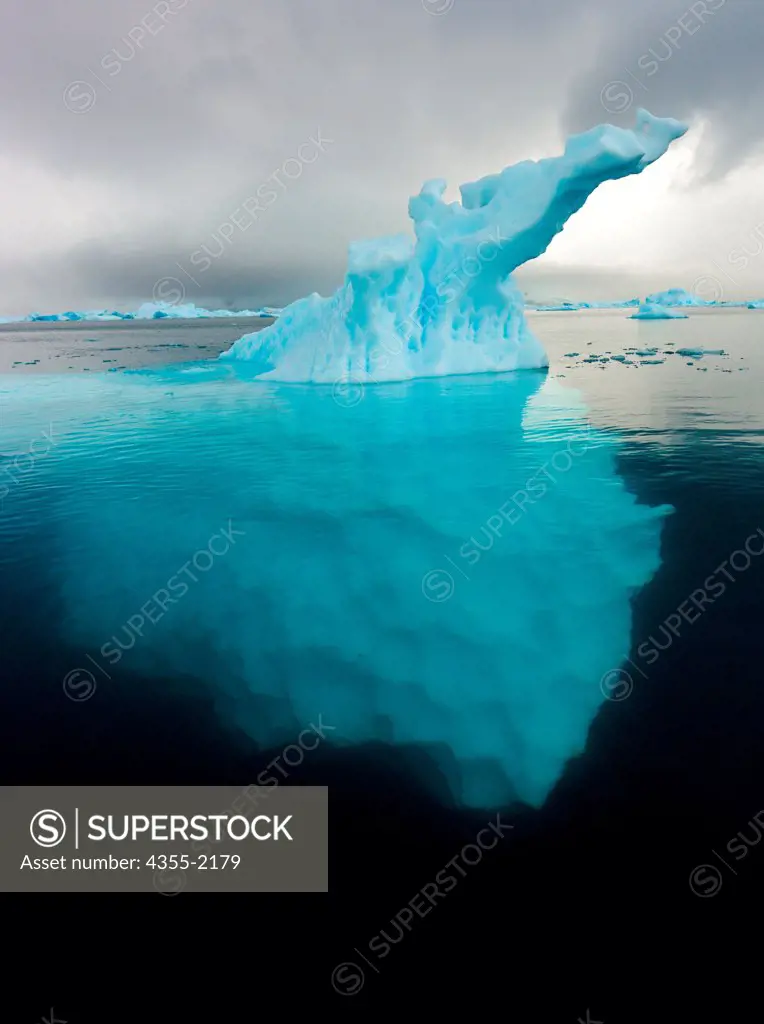 View of Iceberg extending deep into the ocean in Paradise Cove, Antarctica