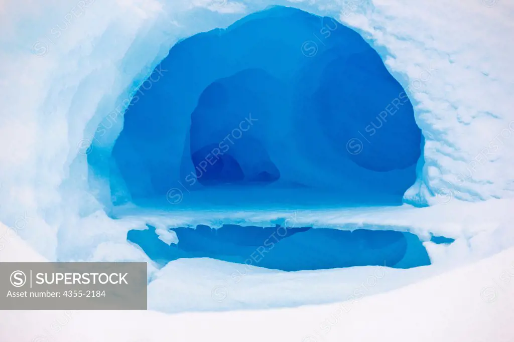 Ice cave in an Iceberg at Petermann Island, Antarctica