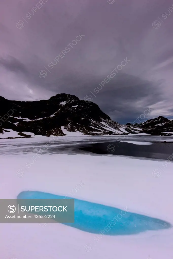 Frozen glacial lake in the mountains above Ushuaia,Argentina. Ushuaia is the capital of the Argentine province of Tierra del Fuego, and the world's southernmost city. It is located on the southern coast of the island of Tierra del Fuego.