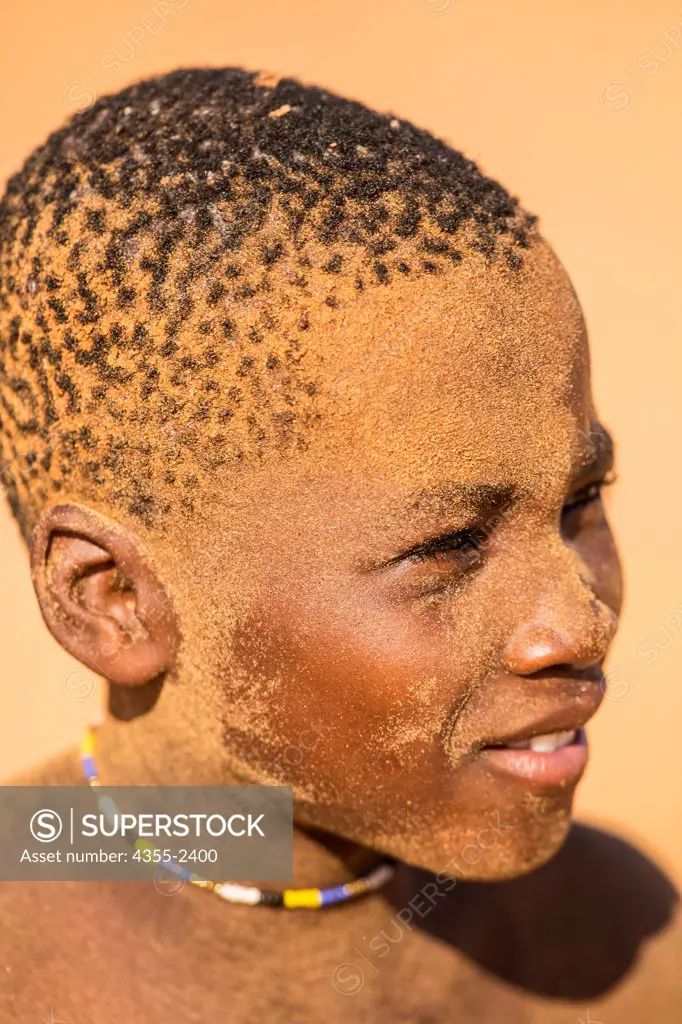 Namibia, Serra Cafema, Close-up of Himba tribe boy wearing necklace