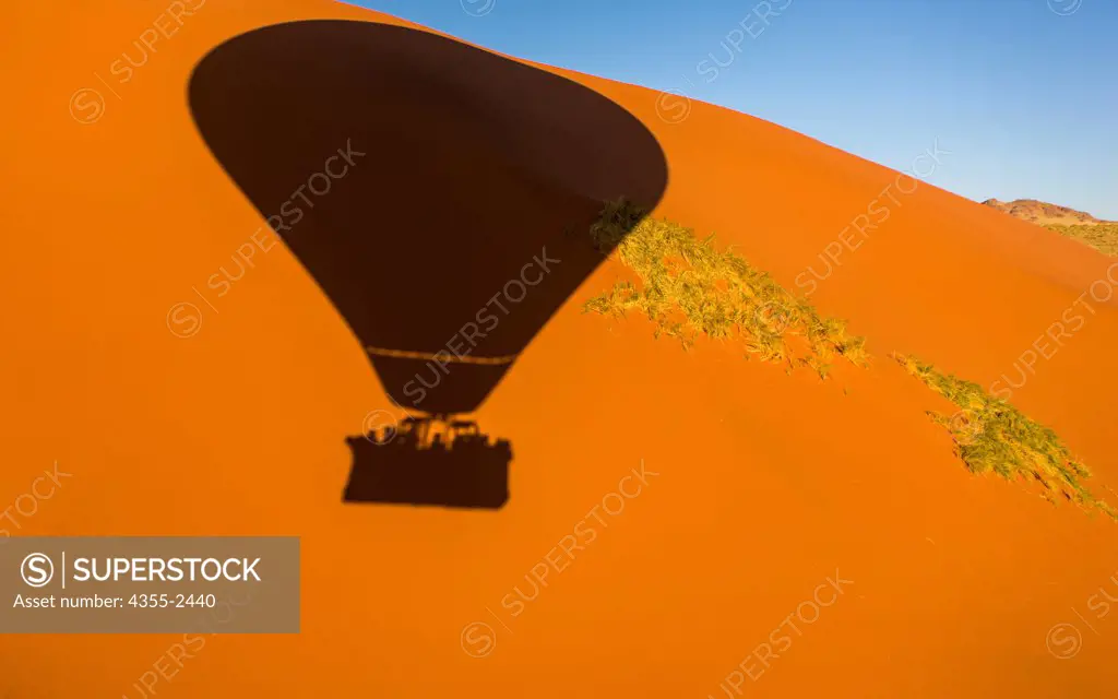Namibia, Namib-Naukluft National Park, Soussusvlei, Hot air balloon shadow on sand dunes