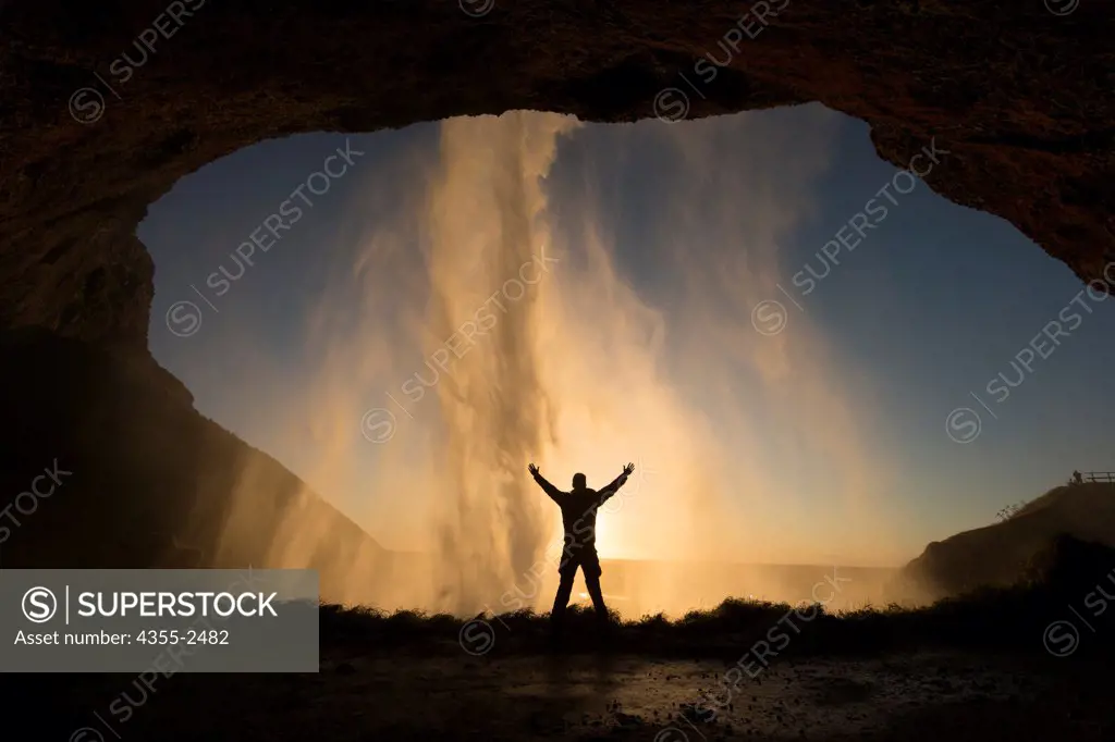 Iceland, View of Seljalandsfoss waterfall from rock cave