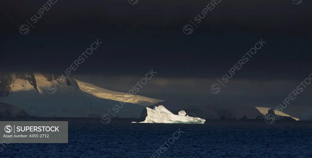 Iceberg floating on water at sunrise in Danko Island, Antarctica