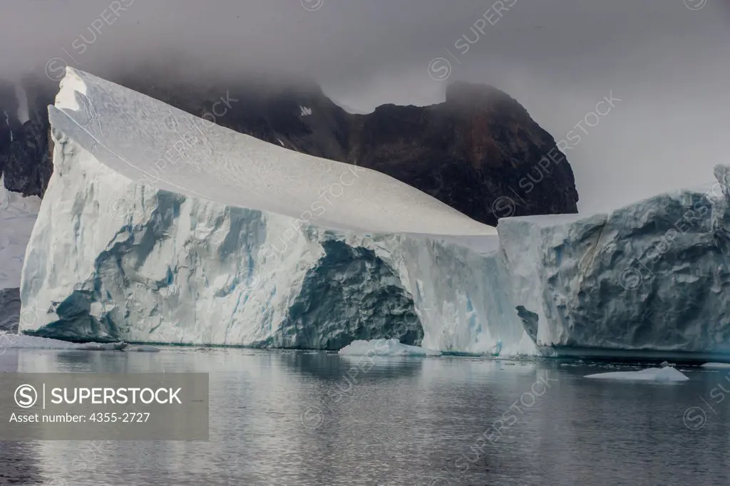 Massive iceberg floating on water, Danko Island, Antarctica