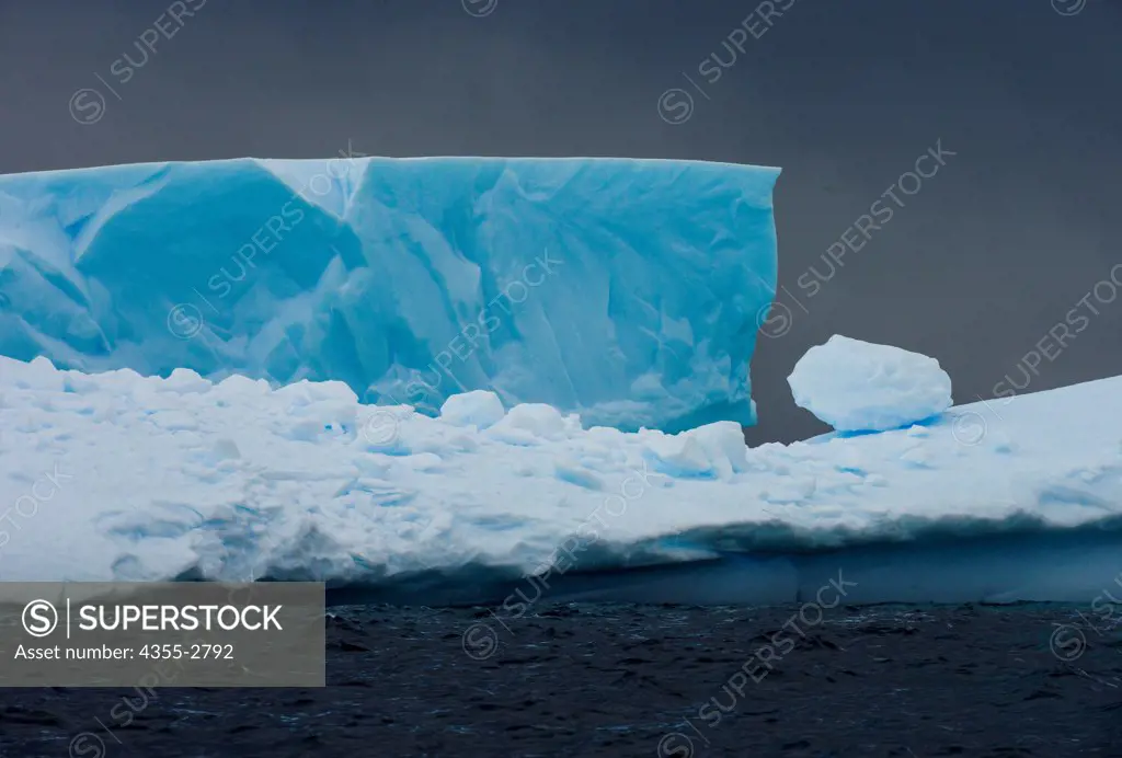 Icebergs floating on water, Petermann Island, Antarctica