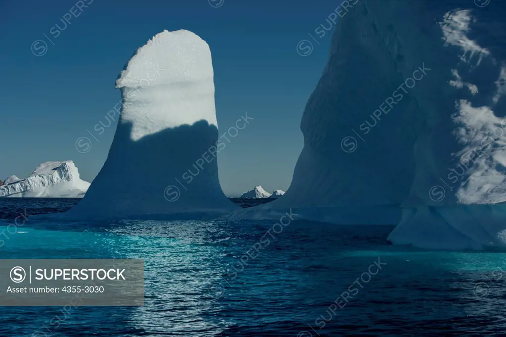 Icebergs floating on water, Bernstorff Isfjord, Sermersooq, Greenland