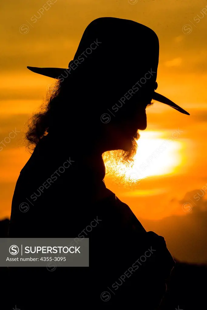 Silhouette of an old man with hat and beard, Chimayo, New Mexico, USA