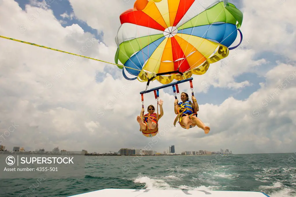 Two Vacationers Parasailing