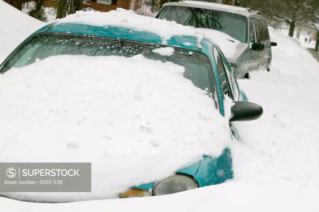 Cars are buried by a Blizzard