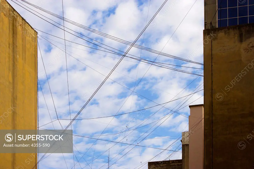 Telephone and Power Lines Criss-Cross a Street in Buenos Aires