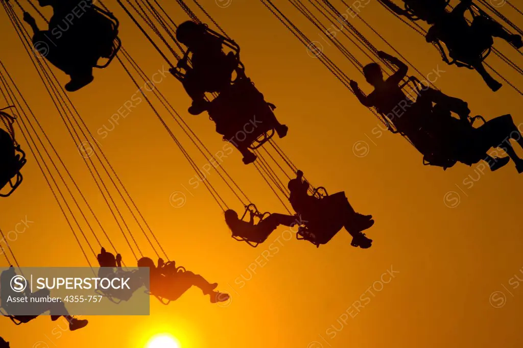 Silhouettes on the Swings
