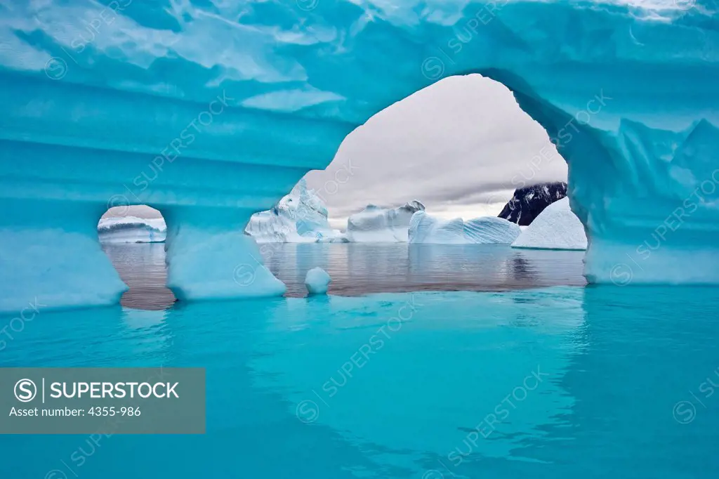 Arched Iceberg in Iceberg Graveyard, Antarctica