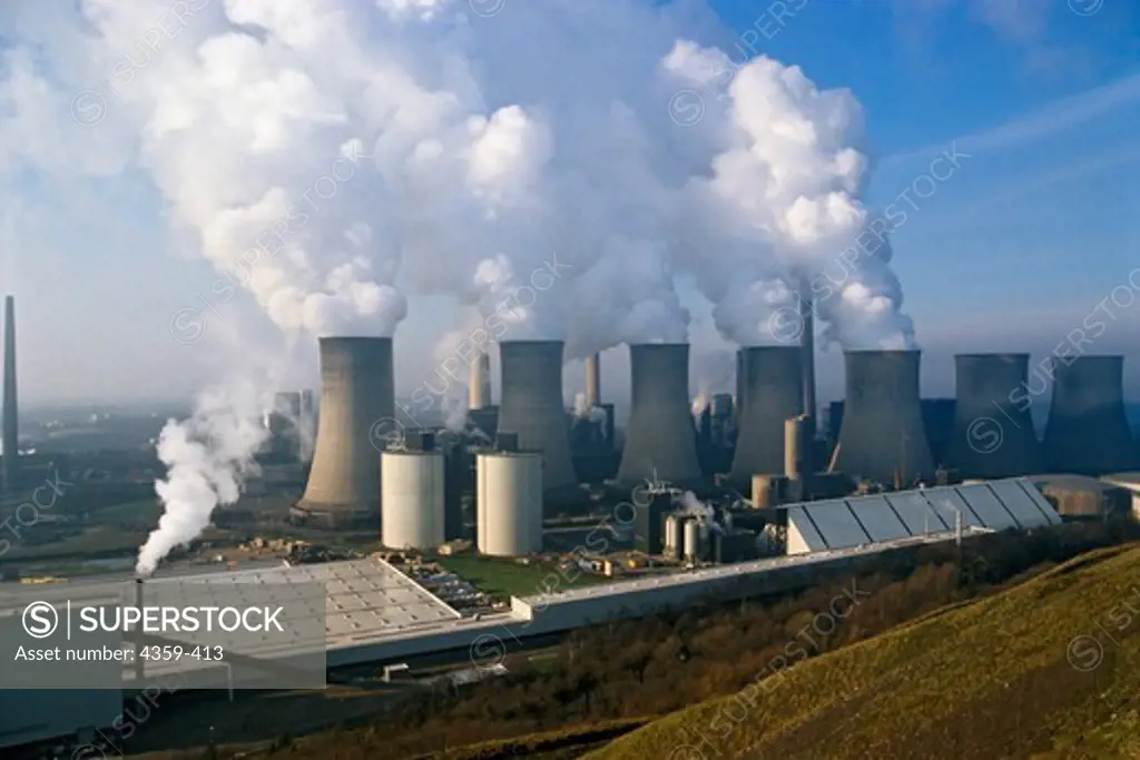 A coal fired power station next to a gypsum plant, which processes gypsum that has been produced by the flue gas desulphurization of the power station. Northrhine-Westfalia, Germany.