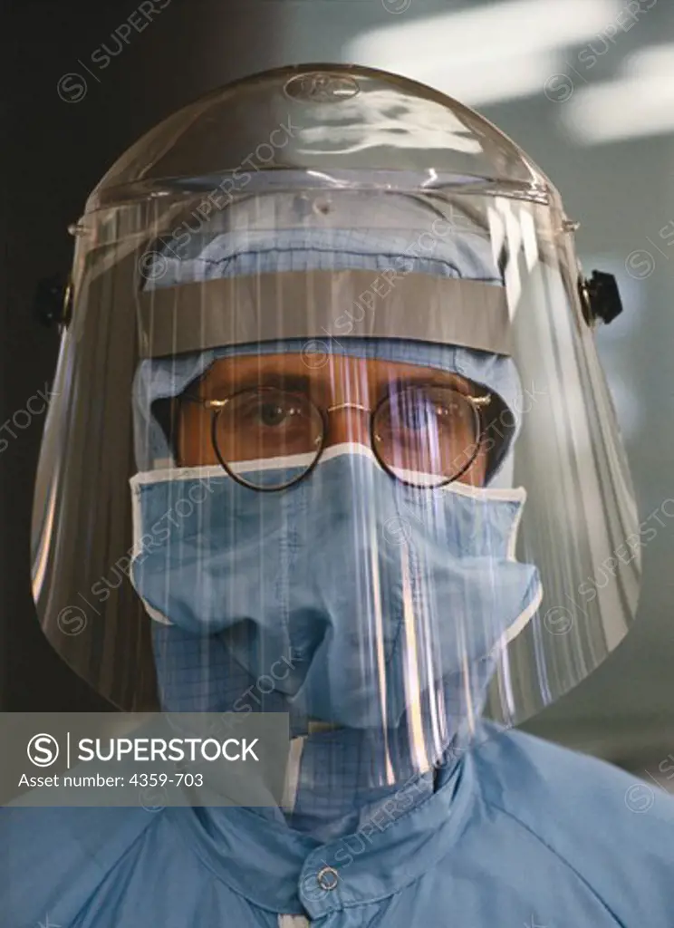 Portrait of man with clean room clothing and face protection