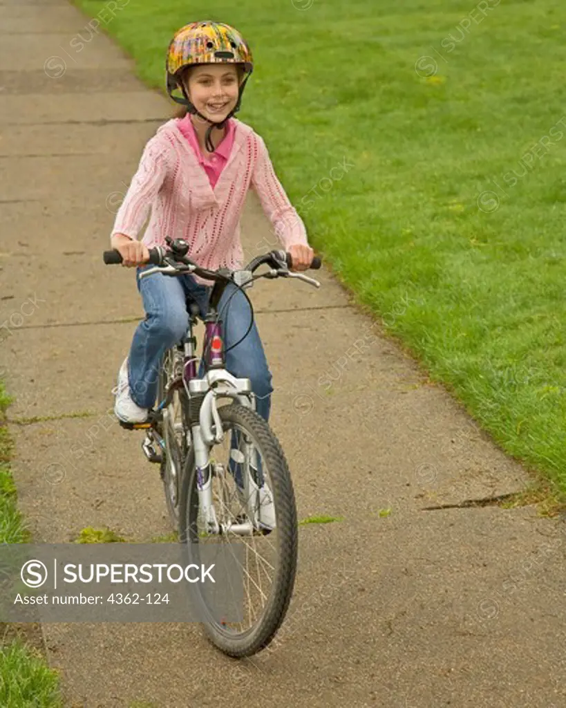 Girl Riding a Bicycle