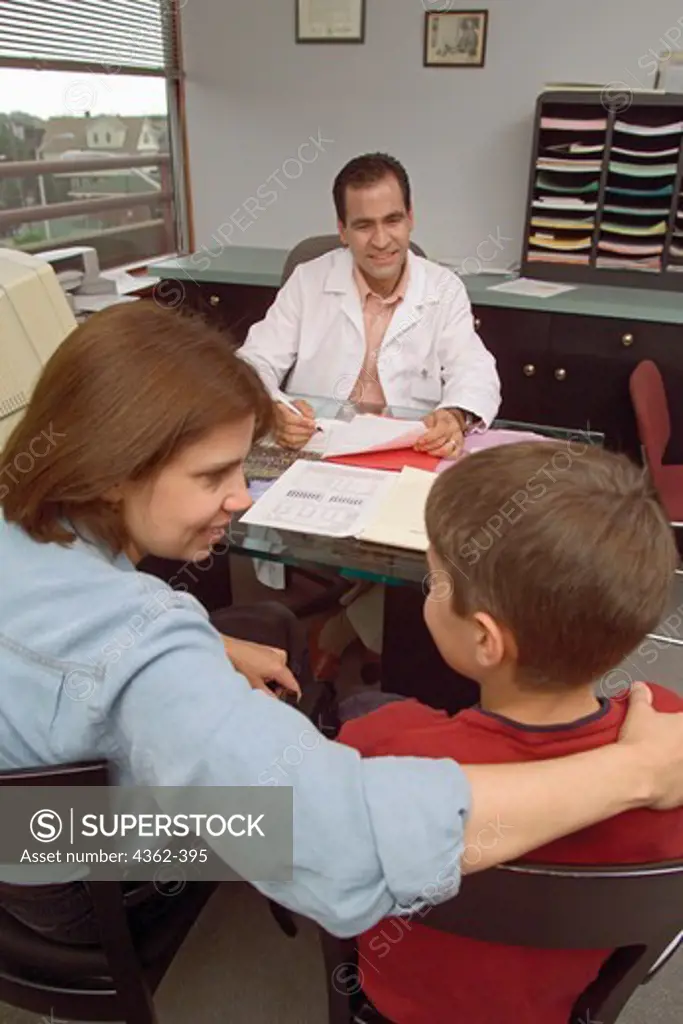 Mother and Son Discuss Options with Pediatrician