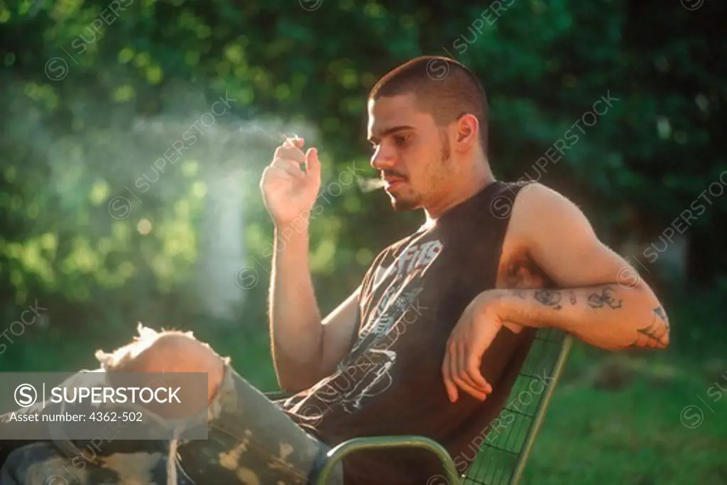 Tattooed Man Smoking