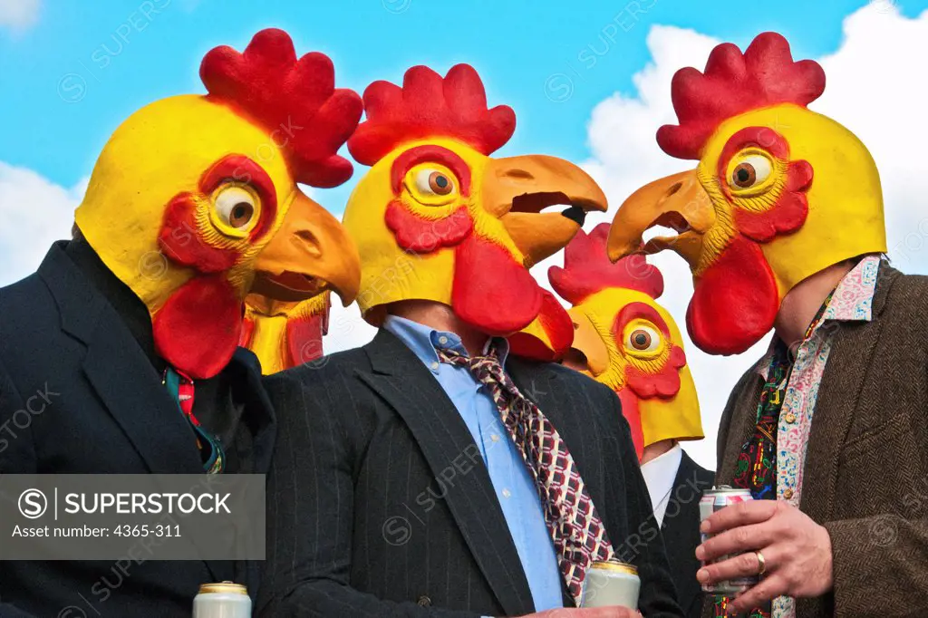 A group of men in business suits and loud ties wearing rubber chicken heads look confused at one another.