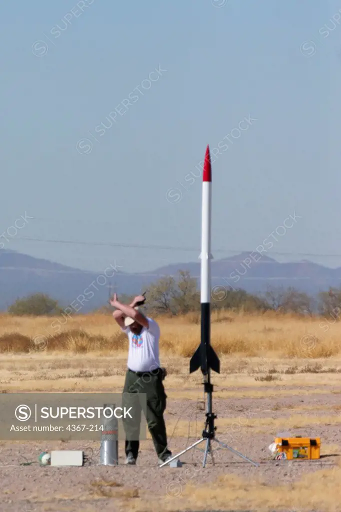 Bob Gorman prepares his hybrid rocket at a launch event sponsored by the Southern Arizona Rocketry Association (SARA). A hybrid rocket uses two types of fuel in two different states, i.e., liquids and solids, in one rocket.