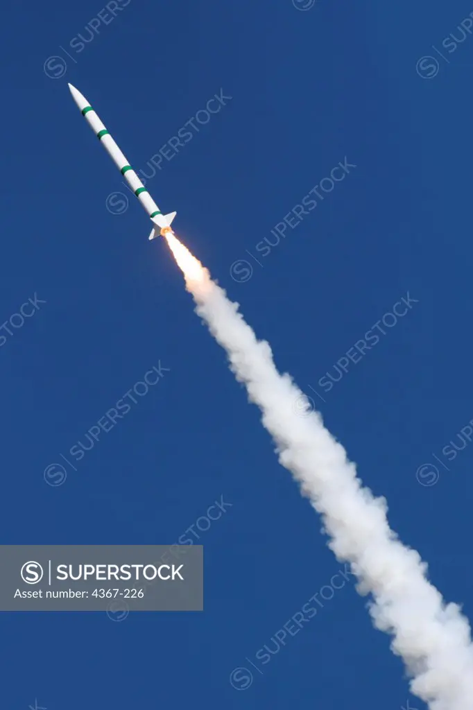 Larry Foster's green and white rocket shoots skyward at a launch event sponsored by the Southern Arizona Rocketry Association (SARA).