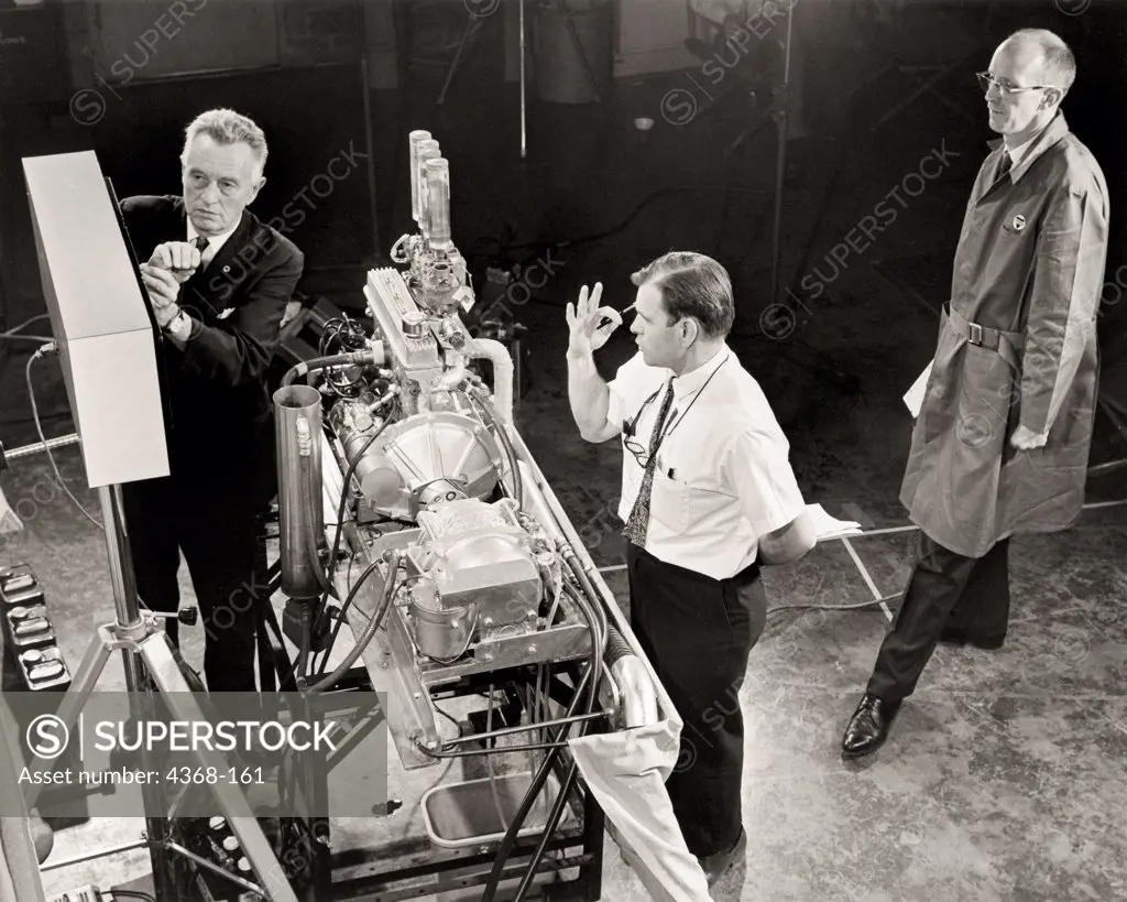 Ethyl Corporation, a fuel-additive corporation, was the first to use tetraethylene (TEL) as an anti knock additive in gasoline.  Here a mock up of an engine demonstrates the difference in Premium, Standard and Regular gasoline performance at an early press conference in the early 1960s.