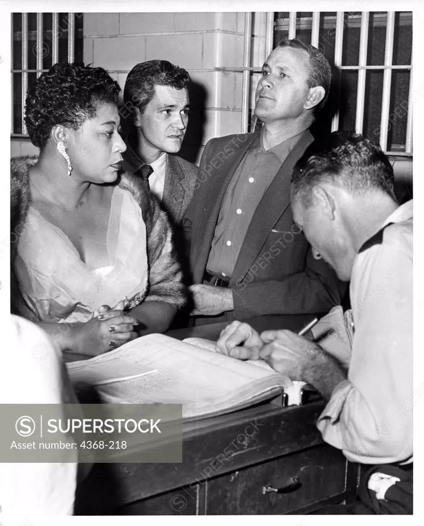 USA, Texas, Huston, Singer Ella Fitzgerald and Johnny Goyen at Housten Police department on alleged gambling charges