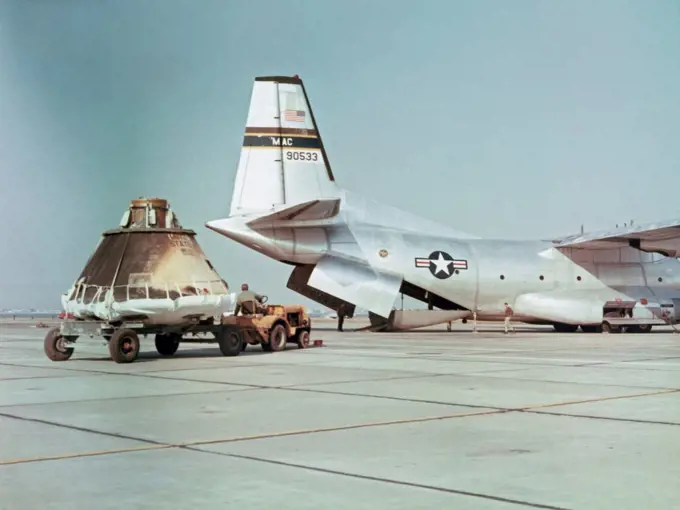 A Military Airlift Command C-130 aircraft prepares to load the flown AS201 command module for transport to the Manned Spacecraft Center, Houston, Texas for further review and tests after its February 1966 suborbital test flight.
