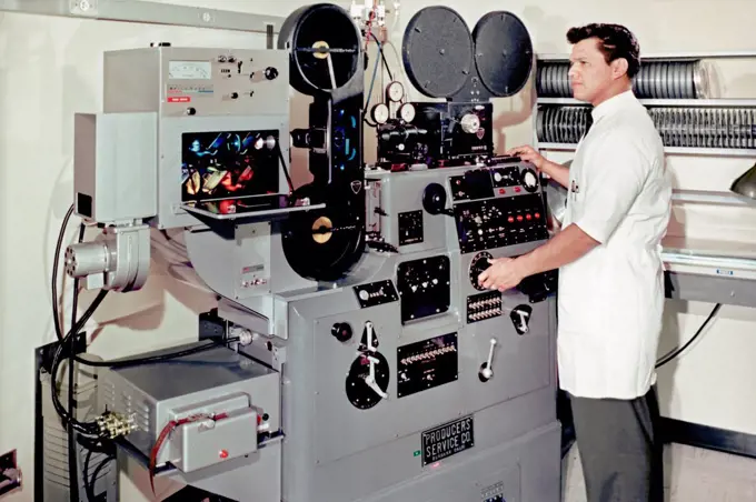 An optical printer, circa 1964. Photo optical printers were used to create effects on film, from dissolves and zooms to aspect ratio changes. This printer also has a color head (left) allowing for color correction.