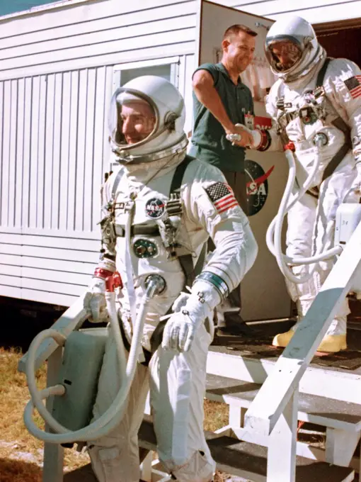 Gemini 12 prime crew, Astronauts James A. Lovell Jr. (leading), command pilot, and Edwin E. Aldrin Jr., pilot, leave the suiting trailer at Launch Complex 16 during prelaunch countdown.