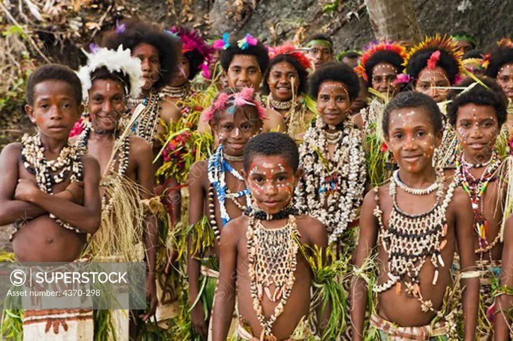A group of children at a cultural presentation by participating tribes in Tufi, Papua New Guinea.  Participating clans were the Fighoya, Kandoro, Tewari, Gaboru, and  Safu from the villages of Koje, Kofure, Iagirua, Koave, Marabade, Fodoma, Bekoyana, and Koyatona.