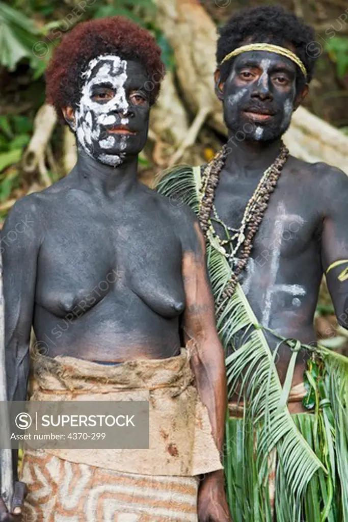 A New Guiean couple at a cultural presentation by participating tribes in Tufi, Papua New Guinea.   Participating clans were Fighoya, Kandoro, Tewari, Gaboru, and Safu from the villages of Koje, Kofure, Iagirua, Koave, Marabade, Fodoma, Bekoyana, and Koyatona.