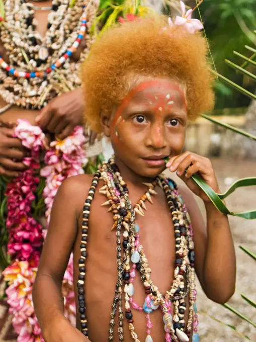 A girl at a cultural presentation by participating tribes in Tufi, Papua New Guinea.  Participating clans were the Fighoya, Kandoro, Tewari, Gaboru, and Safu from the villages of Koje, Kofure, Iagirua, Koave, Marabade, Fodoma, Bekoyana, Koyatona.