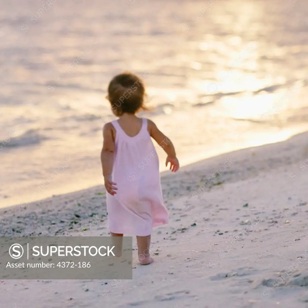 Little Girl Toddling on a Beach