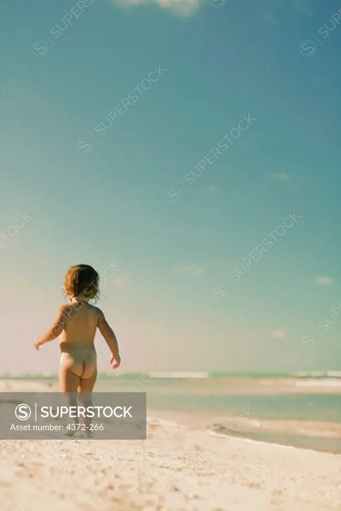 Little Girl Toddling on the Beach