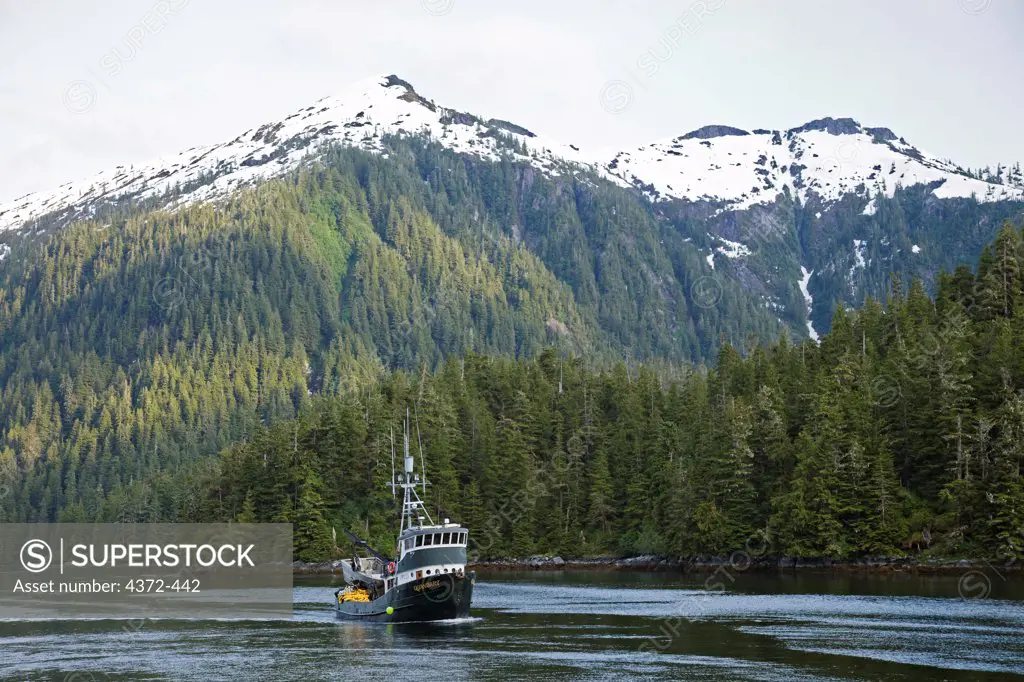 A fishing trawler near the tiny town of Baranof, famous for natural hot springs, on Baranof Island along the Inside Passage, off the Chatham Strait in Alaska.