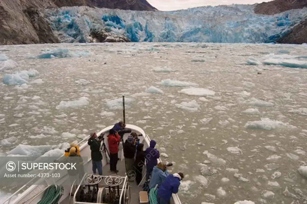 Tourists Look On as the Tracy Arm Glacier Recedes