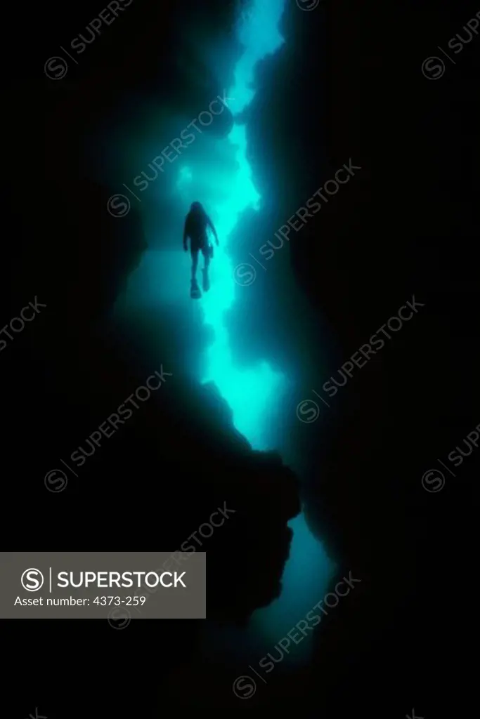 Diver Silhouetted in Grottoes