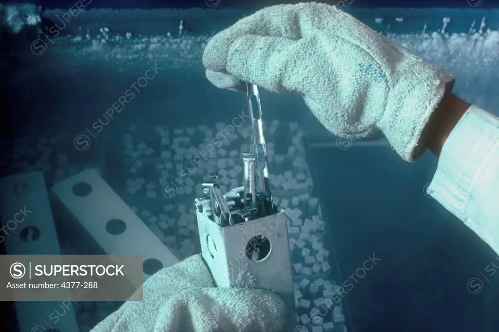 A Cryogenics Engineer Extracts Frozen Cells